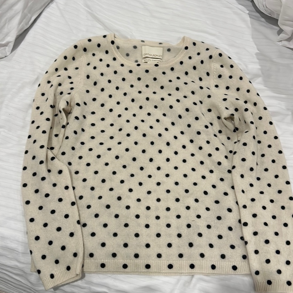 Cashmere sweater off white with black polkadots.